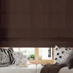 Blank roman blind on a window with wide windowsill mockup. 3D rendering