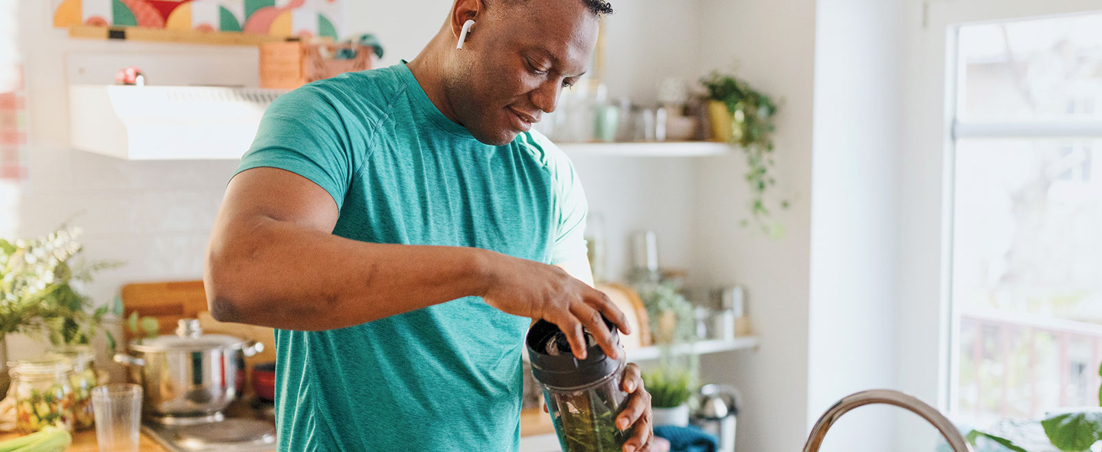 man making a smoothie