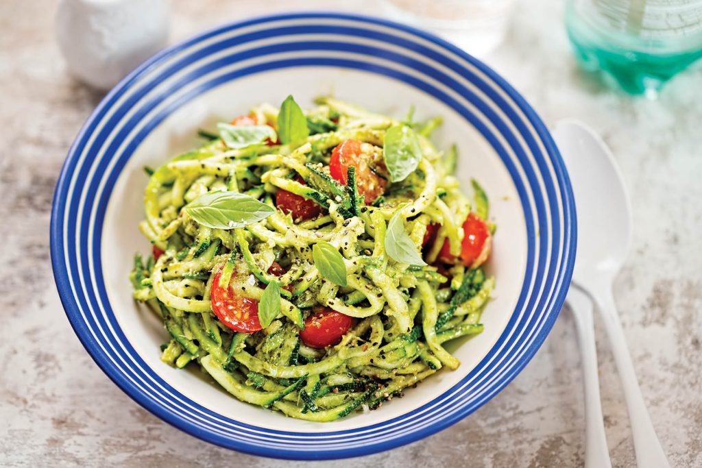 Spiralled courgette spaghetti with green pesto and cherry tomatoes
