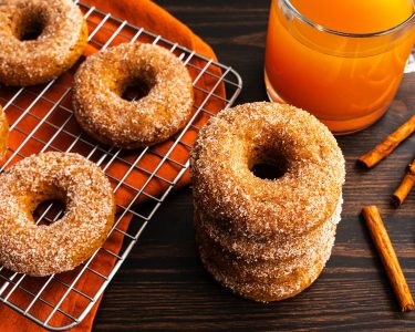 Baked doughnuts cooling on a wire rack viewed from directly above