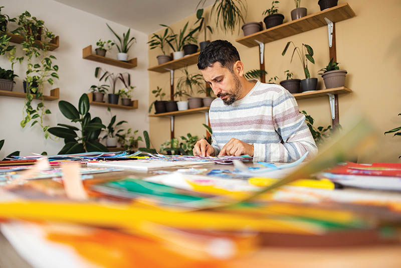Focused artist sitting at desk